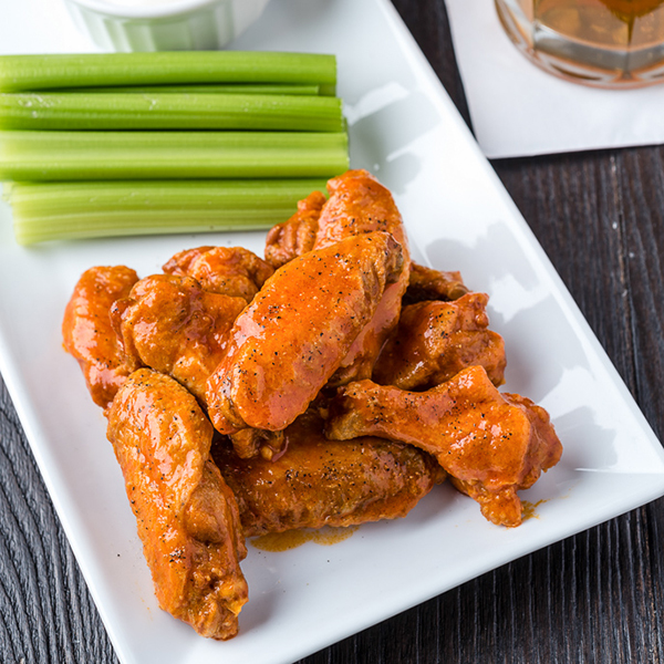 buffalo chicken wings on a square plate