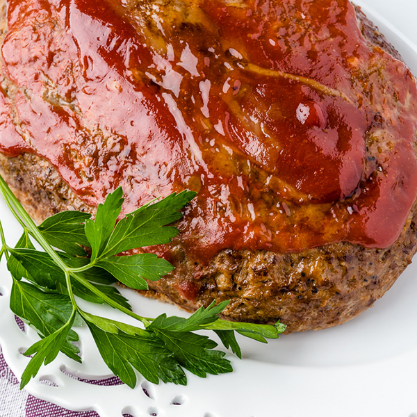 slow cooker meatloaf on a white plate
