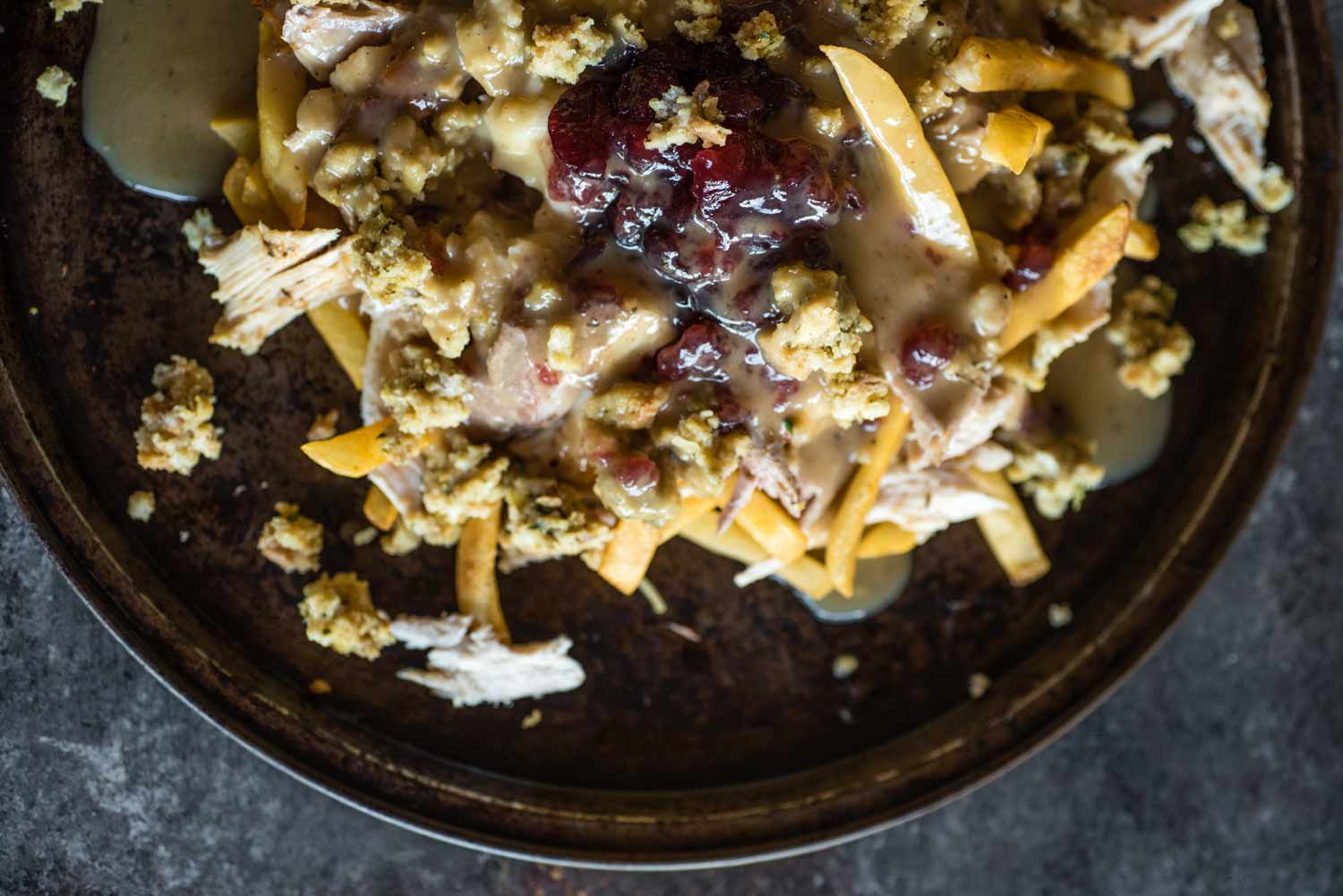 Serve poutine on individual plates or a large serving plate for guests to serve themselves.
